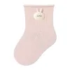 Pink knitted socks with rabbit ear decorations and a LOVE label Item Picture